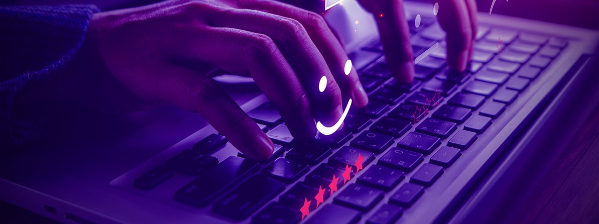 Person typing on keyboard with purple lights. Learn about 7 product marketing trends in our guide for staying ahead.